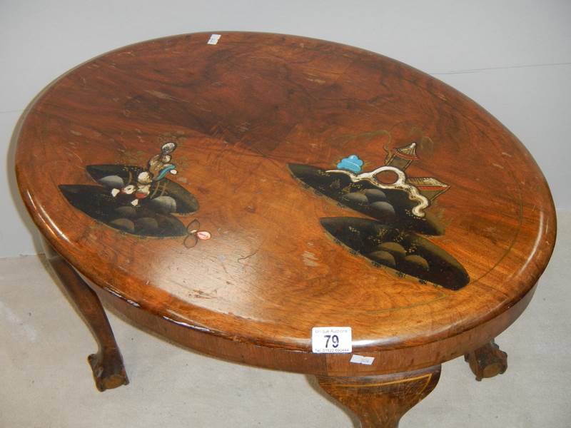 A small oval mahogany table with lacquered pictures, on ball and claw feet, in fair condition. - Image 2 of 4