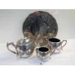 A 4 piece silver plated tea set with pierced gallery tray on ball and claw feet.