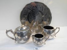 A 4 piece silver plated tea set with pierced gallery tray on ball and claw feet.