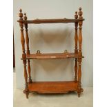 A 3 shelf oak book rack with original turnings and finials, 29" tall.