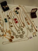 A mixed lot of costume jewellery including necklaces, earrings, brooches etc.