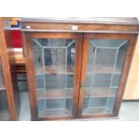 An oak 2 door leaded book case, 35" wide x 38" high,