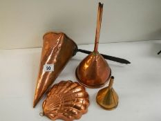 A collection of Victorian and later copper ware including wine muller, beer funnel, jelly mould etc.