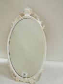 A mid 20th century metal framed oval mirror, in good condition (19" tall).