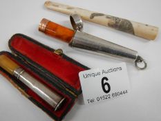 A cased silver cheroot holder with 9ct gold band (a/f),