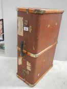 A wooden bound travel trunk in good condition