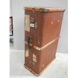 A wooden bound travel trunk in good condition