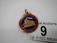 A 9ct gold 'National Union of Railway men' fob,