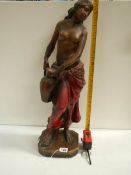 A tall plaster figure with original paintwork, 26" tall and in good condition.