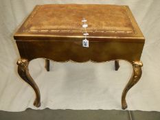 A gilt piano stool, in good condition,