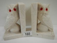 A pair of alabaster owl bookends.