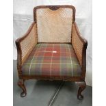 A Victorian mahogany bergere arm chair in excellent condition and with extra cushion.