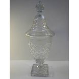 A mid 20th century cut glass lidded jar, approximately 15" tall, in good condition.