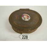 A Victorian French oval metal box with hand painted plaque, 5" wide.