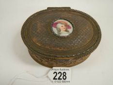 A Victorian French oval metal box with hand painted plaque, 5" wide.