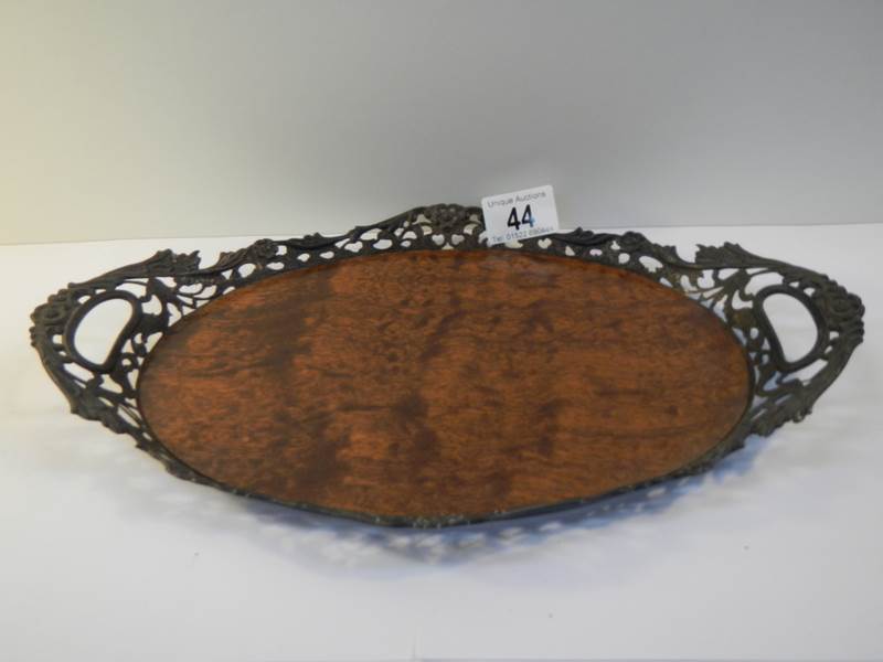 An early 20th century silver plate and walnut tray, 14" wide, needs cleaning but in good condition.