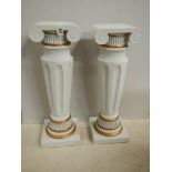 A pair of matching pillars, 25.5" tall, in good condition.