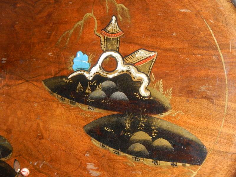 A small oval mahogany table with lacquered pictures, on ball and claw feet, in fair condition. - Image 3 of 4