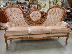 A super triple back mahogany framed sofa, frame in good condition,