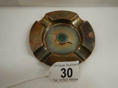 A unusual silver ashtray with Bentley symbol to centre.