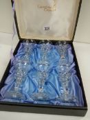 A boxed set of 6 Cumbria crystal wine glasses, 5" tall.