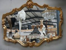 A good oval gilt framed mirror,