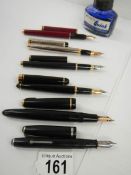 A quantity of old fountain pens.