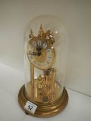 An early 20th century anniversary clock under dome, in working order.