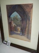 A small signed watercolour of a lady under arch, 9.5" x 11.