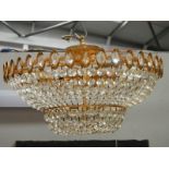 A good quality brass and glass chandelier, 24" diameter x 15" drop.