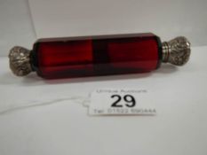 A Victorian ruby glass double ended scent bottle, 5" long, in good condition.