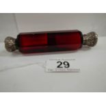 A Victorian ruby glass double ended scent bottle, 5" long, in good condition.