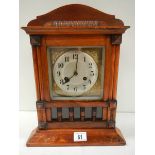 An early 20th century mantel clock in working order (spring ok and complete).