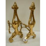 A good pair of solid brass Victorian fire dogs, 16" high.