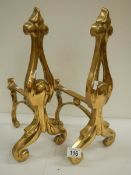 A good pair of solid brass Victorian fire dogs, 16" high.