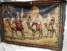 A large wall hanging of camels, good colours,