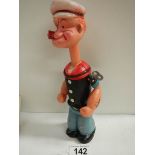 A vintage clockwork figure of Popeye, in working order.