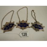 A set of 3 plated and enamel wine labels.