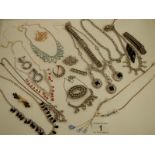 A mixed lot of costume jewellery including necklaces, bracelets, brooches etc.