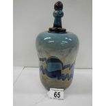 A very unusual studio glass stoppered jar, 8.5" tall, in good condition.