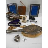 A mixed lot of interesting items including silver rattle, brush etc.