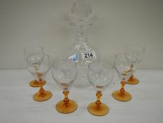 A Royal Doulton crystal decanter and a set of 6 deco glasses with amber glass stems.