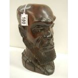 A carved hardwood bust of a man in good condition,