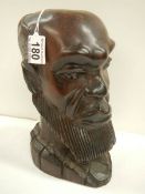 A carved hardwood bust of a man in good condition,