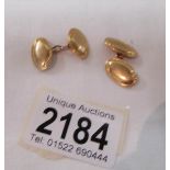 A pair of 18ct gold cuff links, marked '18', approximately 12 grams.