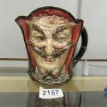 A Royal Doulton double faced character jug depicting the devil.