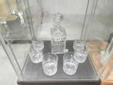 A cut glass decanter and 6 cut glass whisky tumblers.