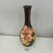 A Moorcroft limited edition hibiscus vase marked to underside No.