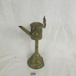 A 19th century brass whale oil lamp.