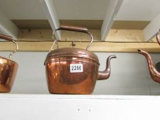 A Victorian copper kettle with acorn knob to lid.